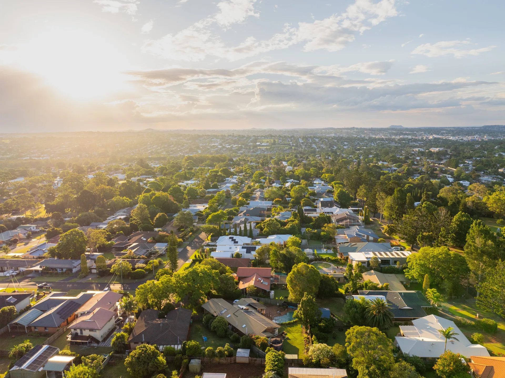 Aerial view across a leafy Sunshine Coast residential suburb
