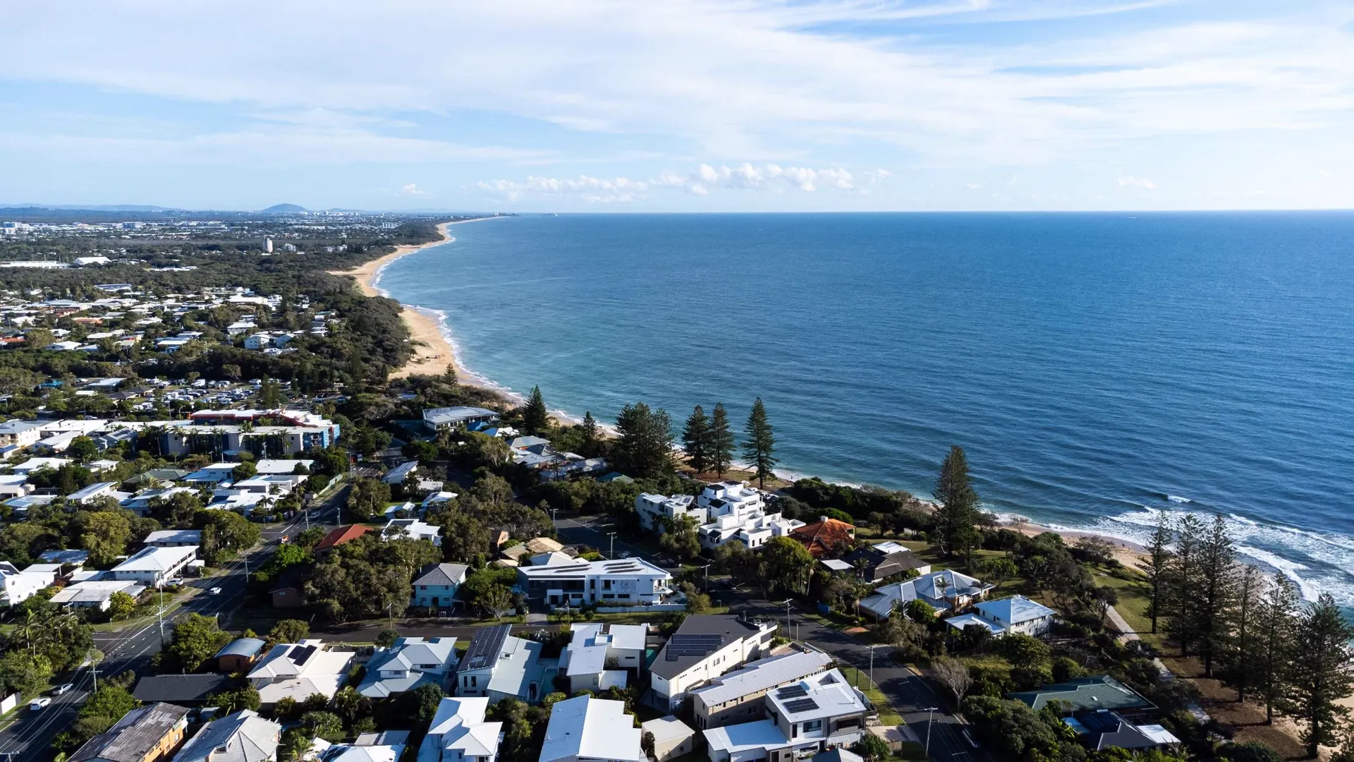 Aerial view along the Caloundra coastline and beachside homes