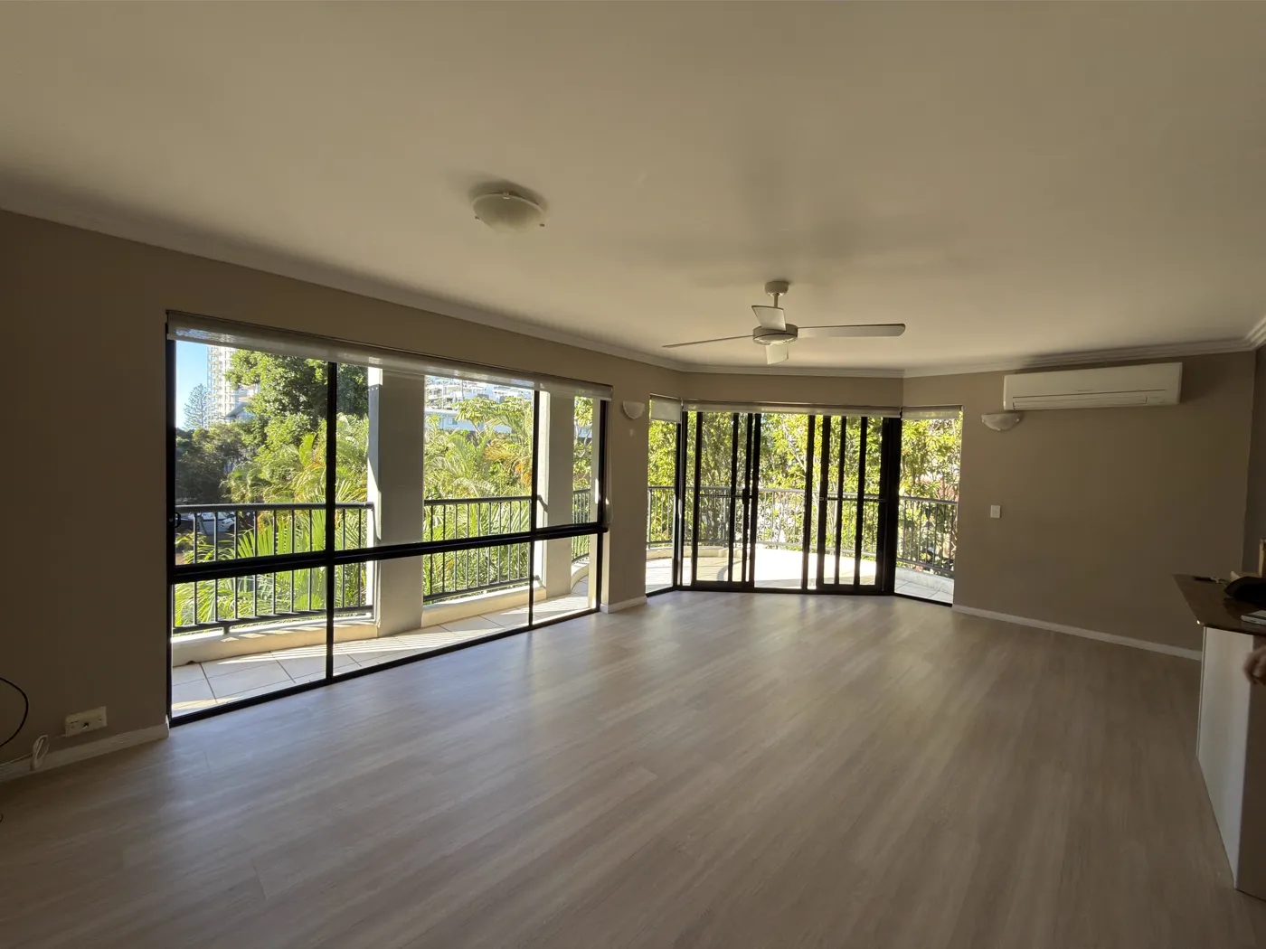 Open living room with sliding doors onto a Queensland balcony